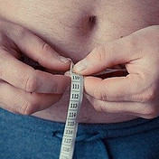 Man with Measuring Tape round his Belly