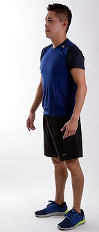 Picture 1 Man In Shorts standing upright arms by his side