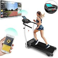 a picture depicting a lady running on the Bluefin Kick 2.0 treadmill, watching a TV if she were on a road.