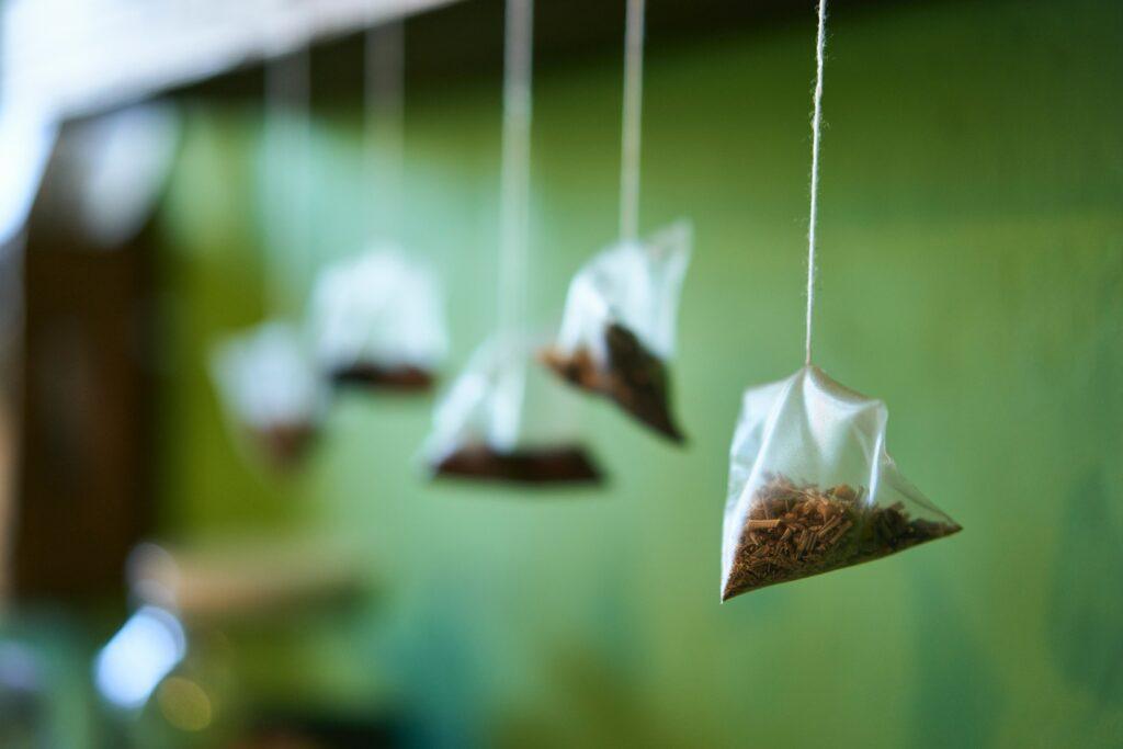We have 5 Tea Bags Hanging down from a beam.