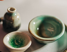 A Picture showing 2 smalls bowls and small Pot.