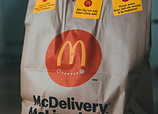 A McDonalds Paper Delivery bag of Junk Food