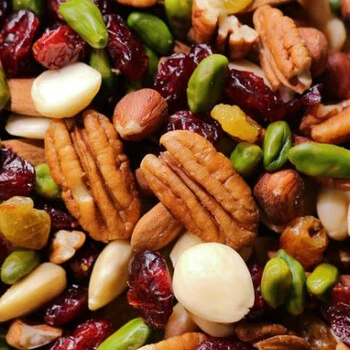 We have a variety of Nuts on a plate along with some cranny berries.